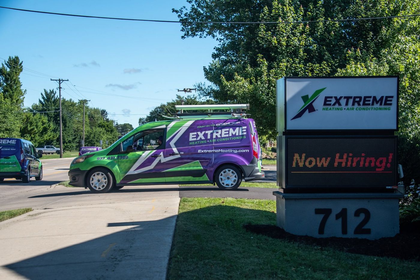 An Extreme Heating, Air, Plumbing service van at the Beavercreek office sign on North Fairfield Road